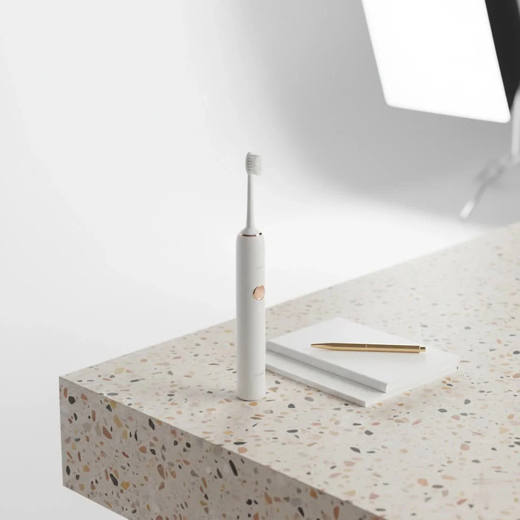 Close-up of a top-rated electric toothbrush with a sparkling smile